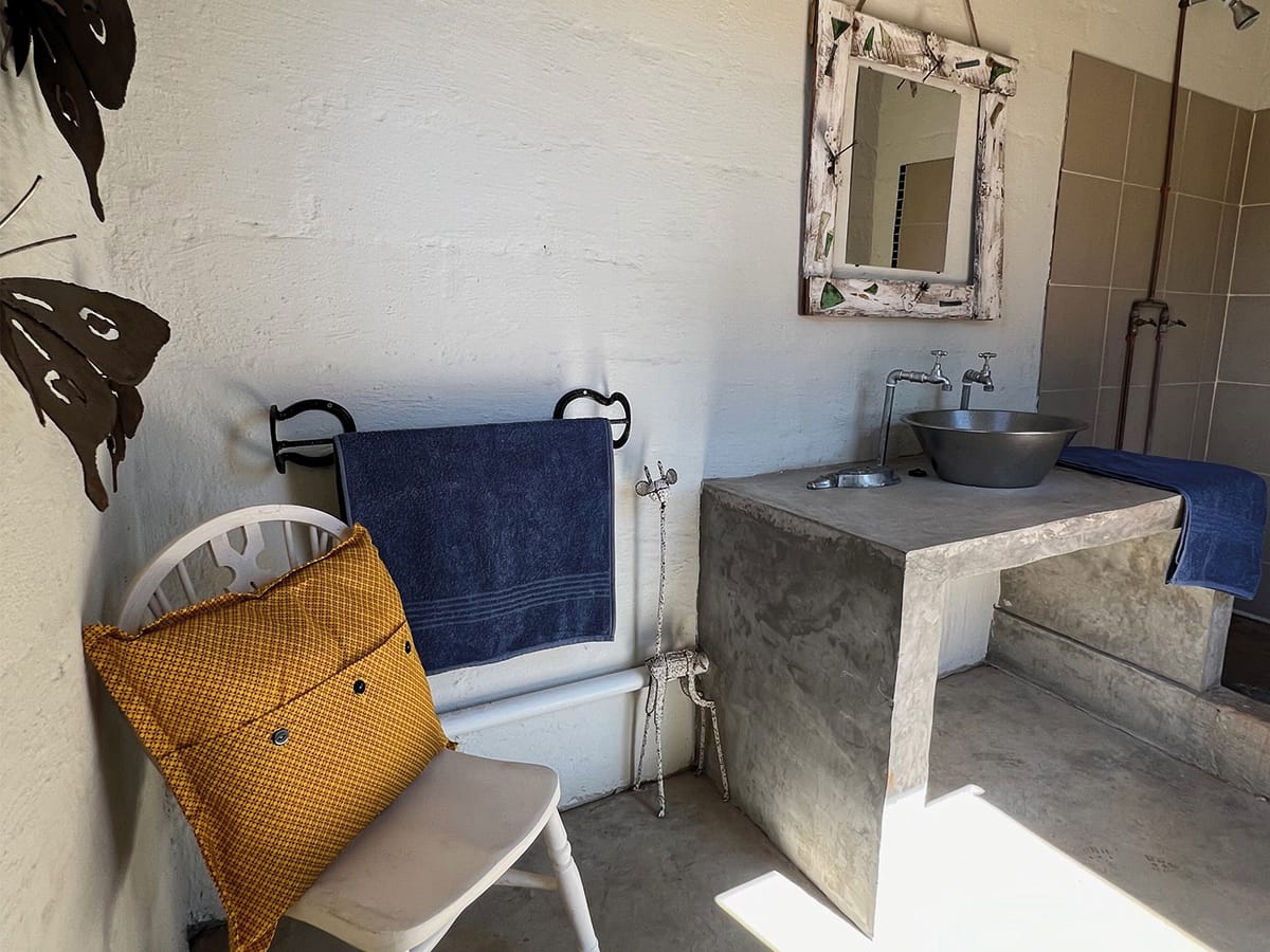 Traditional braai cooking at Wild Bhiza homestead near Victoria Falls, Zimbabwe, where authentic African meals are prepared for volunteers and guests
