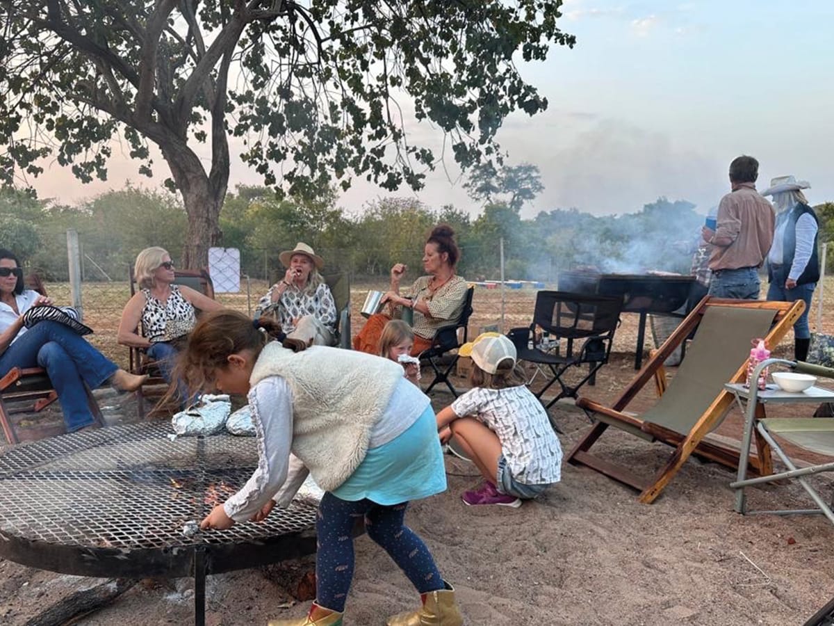 Traditional African braai cooking at Wild Bhiza homestead near Victoria Falls, Zimbabwe, where authentic meals are prepared over open flames for volunteers and guests