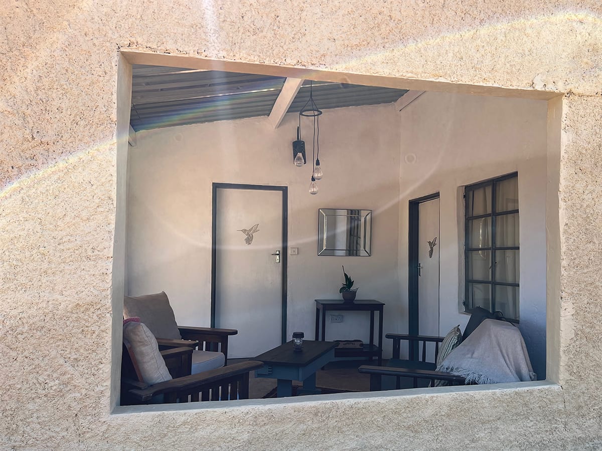 Comfortable lounge area with seating and views at Wild Bhiza accommodation Zimbabwe