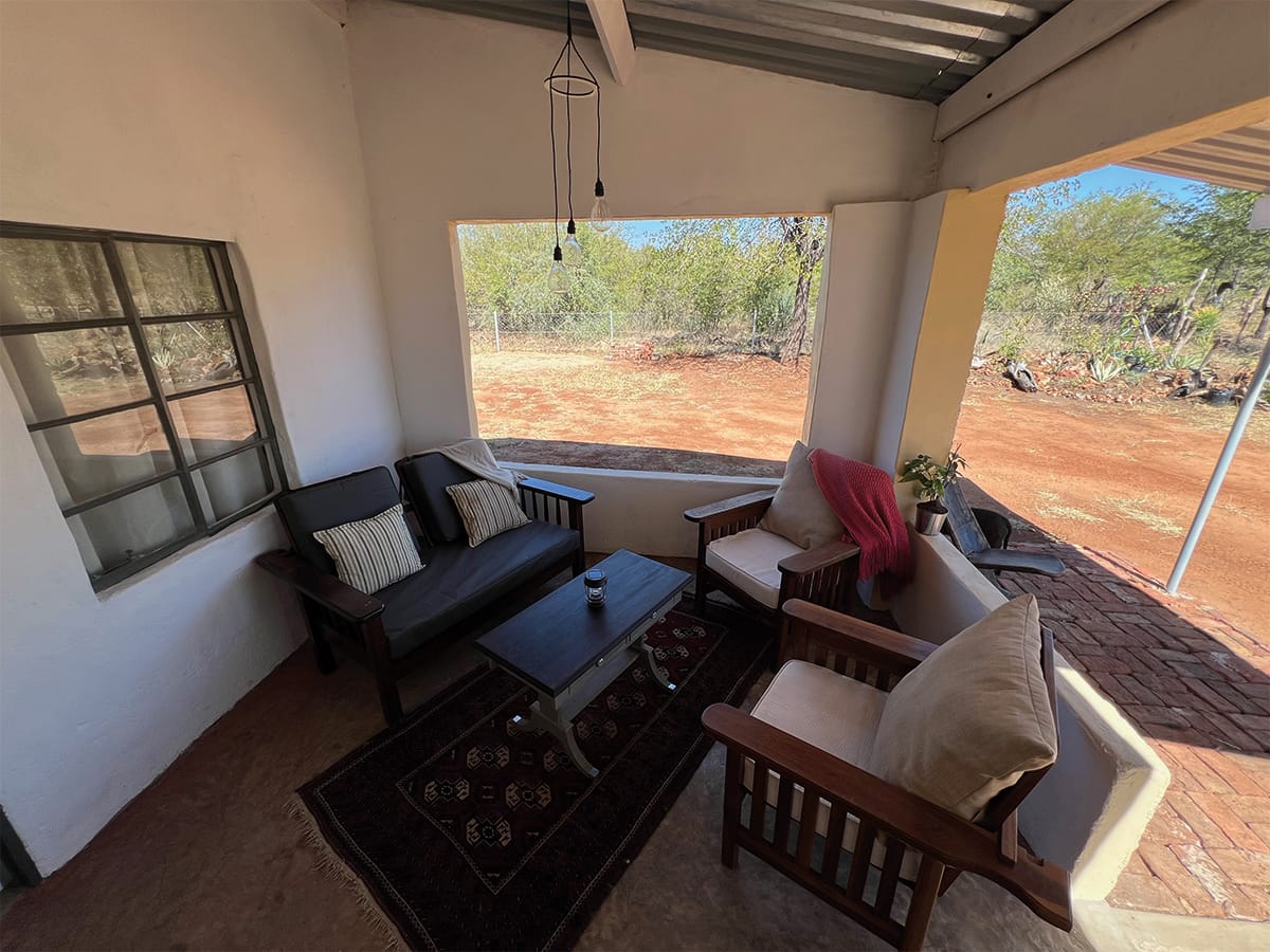 Comfortable lounge area with seating and views at Wild Bhiza accommodation Zimbabwe